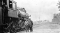 Atlantic Coast Line Railroad Company workman and conductor by engine #232.