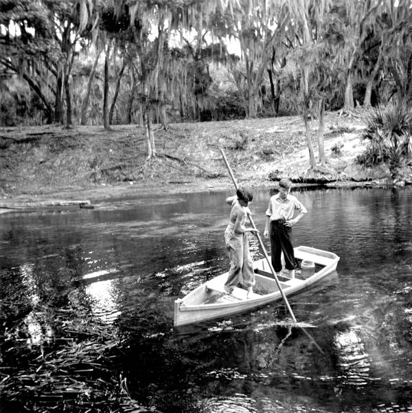 Boys in a small boat near the vents at Salt Springs (1941).