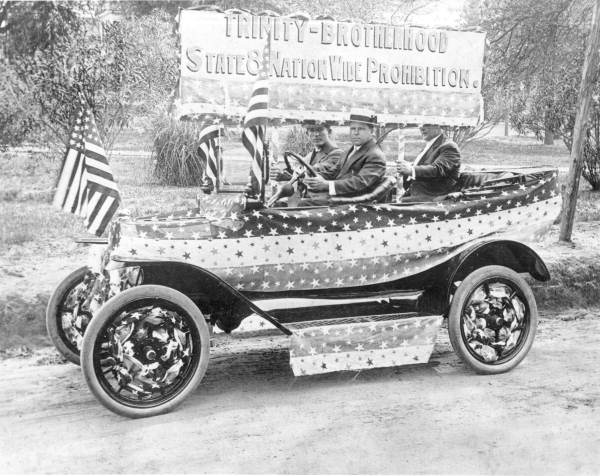 Theo Proctor driving an automobile decorated in support of prohibition - Tallahassee.