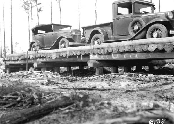 Automobiles on timber bridge: Columbia County, Florida (1933)