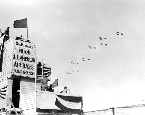 Army planes fly over the timing stand at the Sixth Annual All-American Air Races (1934).