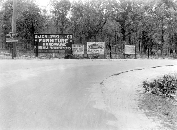 Advertising signage located close to the roadway near Eustis (1917).