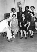 Dr. Coughlin, Director of the pre-natal clinic (at left), sitting with members of the staff.