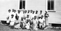 Group portrait of African American midwives during a meeting in Polk County, Florida.