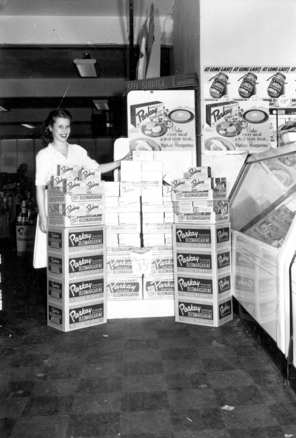 Edvis Newton stands with a Kraft margarine display at a Jitney Jungle store in Tallahassee (1947). Who knew such a popular product had such a contentious history?