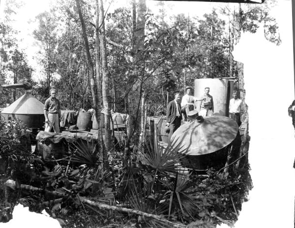 Men with equipment used to make moonshine - Jacksonville , Florida.