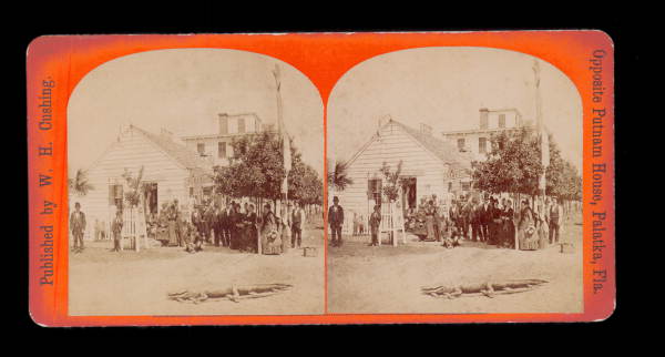 Crowd in front of general store looking at alligator - Palatka, Florida