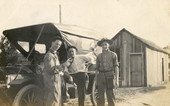 George Barton Hall Sr., left, standing with friends next to car in Hall City.