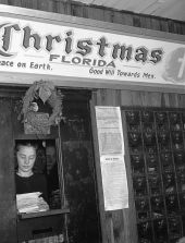 Mrs. Juanita S. Tucker sorting letters to Santa - Christmas, Florida