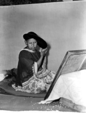 Seminole Indian woman Letagi (who has taken the Christian name of Frances Willie) styling her hair in Miami, Florida.