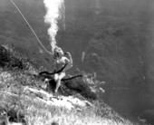 Unidentified woman drinking coke underwater during performance as a mermaid at Weeki Wachee Springs.