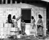 Charlotte Osceola points out features of her new home to friends - Dania, Florida