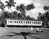 A young girl watches the passenger car "Rambler" on display at the Flagler Museum - Palm Beach, Florida.