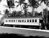 A young girl stands on the passenger car "Rambler" displayed at the Flagler Museum - Palm Beach, Florida.