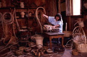 Basket weaver working at the Medieval Life attraction in Kissimmee, Florida.