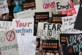 Close-up view showing signs from student demonstrators during the Never Again Rally in Tallahassee.