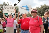 Gun-control activists holding up their signs at the Never Again Rally in Tallahassee.