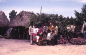 Photographer's wife Gladys posing with Susie Billie and her family at their camp in Naples.