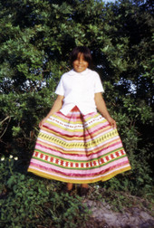 Marie Billie showing new skirt during Christmas celebration at Susie Billie's village in Ft. Myers.