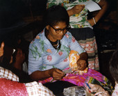 Susie Billie looking at photographs.