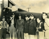 Eddie Rickenbacker, 3rd from left, and Frank Hunter, 3rd from right, with army pilots.