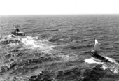 Coast Guard cutter "Cape Strait" with a Haitian refugee boat in tow.