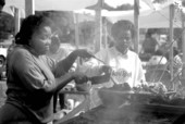 Rosalie Pitts (L) and Rovenia Certain cooking barbecue for Good Samaritan Foods at Zora Neale Hurston Festival- Eatonville, Florida