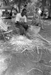 Alfonzo Biggs cutting strips of white oak to make a basket- White Springs, Florida