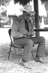 Seminole Indian Frank J. Billie carving wood- White Springs, Florida