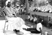 Annie Tomlin telling a story while a boy listens- White Springs, Florida