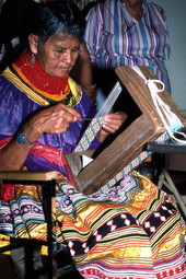 Lottie Shore weaving beads to use on Seminole sash - White Springs, Florida.