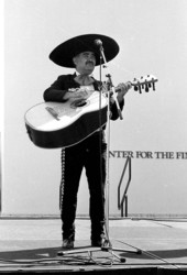 Mariachi Jalisco guitarron player performing at Historical Museum of Southern Florida during Traditions Festival - Miami, Florida.