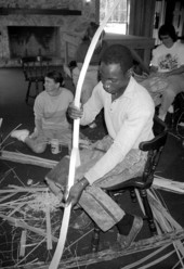 Alfonso Jennings cutting white oak into strips during basketmaking workshop - White Springs, Florida