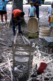 Alfonso Jennings splitting white oak to make a basket at the 1990 Florida Folk Festival - White Springs, Florida