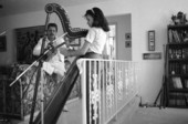 Ana Maria DeArmas playing the Venezuelan harp as Jesus Rodriguez accompanies on cuatro- Naples, Florida