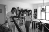 Jesus Rodriguez playing the Venezuelan harp as Ana Maria DeArmas listens- Naples, Florida