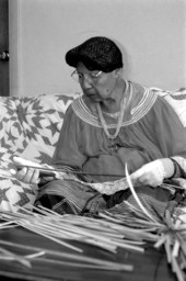 Marian Bowers making a palmetto stem basket - Brighton Seminole Indian Reservation, Florida.