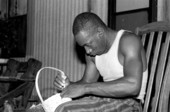 Alphonso Jennings adding a handle to a white oak basket - Lamont, Florida