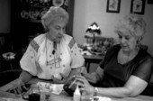 Ola Kryway (L) and apprentice Mary Martin decorating Easter eggs using the Ukrainian pysanky technique - Titusville, Florida.