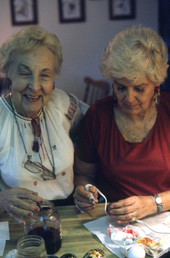 Ola Kryway (L) and apprentice Mary Martin decorating Easter eggs - Titusville, Florida.