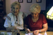 Ola Kryway (L) and apprentice Mary Martin decorating Easter eggs - Titusville, Florida.