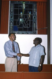 Hymn liner Troy Demps, right, shakes hands with apprentice Brian Wright - Orlando, Florida.