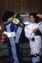 Japanese dancer Kazuko Law, left, going over symbolic hand gestures with her apprentice Ofuyu Forrest - Gulf Breeze, Florida