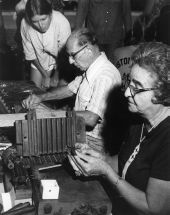 Faustino and Consuelo Fernandez of Tampa demonstrating cigar rolling at the 1977 Florida Folk Festival - White Springs, Florida.