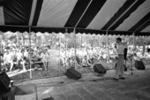 Gamble Rogers telling stories from the old marble stage at the 1987 Florida Folk Festival - White Springs, Florida