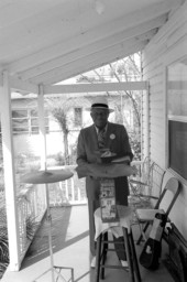William "Washboard Bill" Cooke poses with his instruments