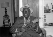 William "Washboard Bill" Cooke poses with his ukulele