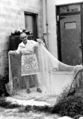 Ada Mickler holding up one of her cast nets in Saint Augustine, Florida.