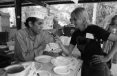 Folklorist Nancy Nusz interviewing Mr. Ramesch from the Mandeer Restaurant at the 1983 Florida Folk Festival - White Springs, Florida