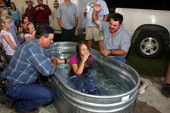 Cross Brand Cowboy Church baptism at Williston Horseman's Park.